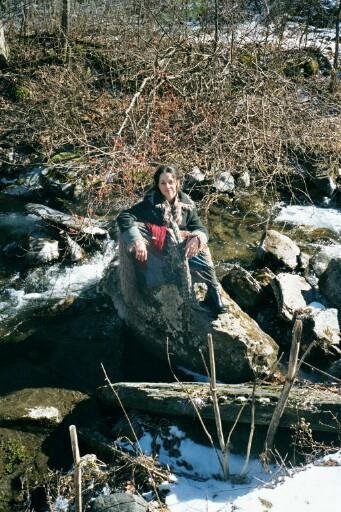 [Melissa (Cardozo) perched on a serious rock]